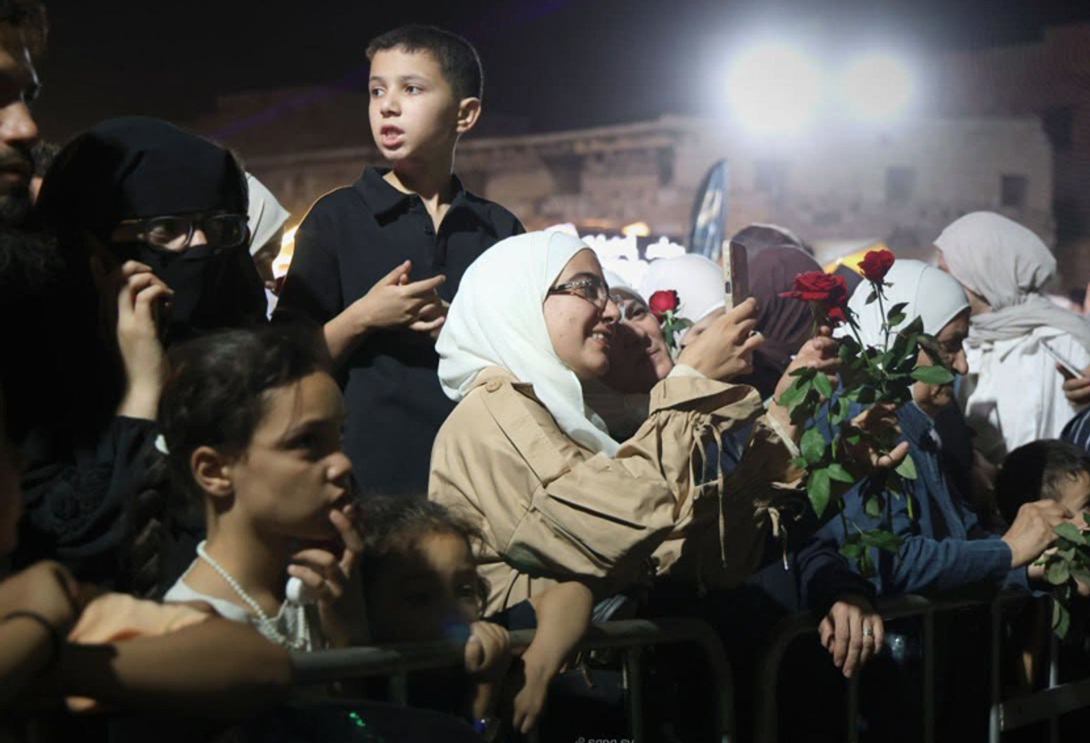 Army drops roses on Syrian crowds in a far cry from war