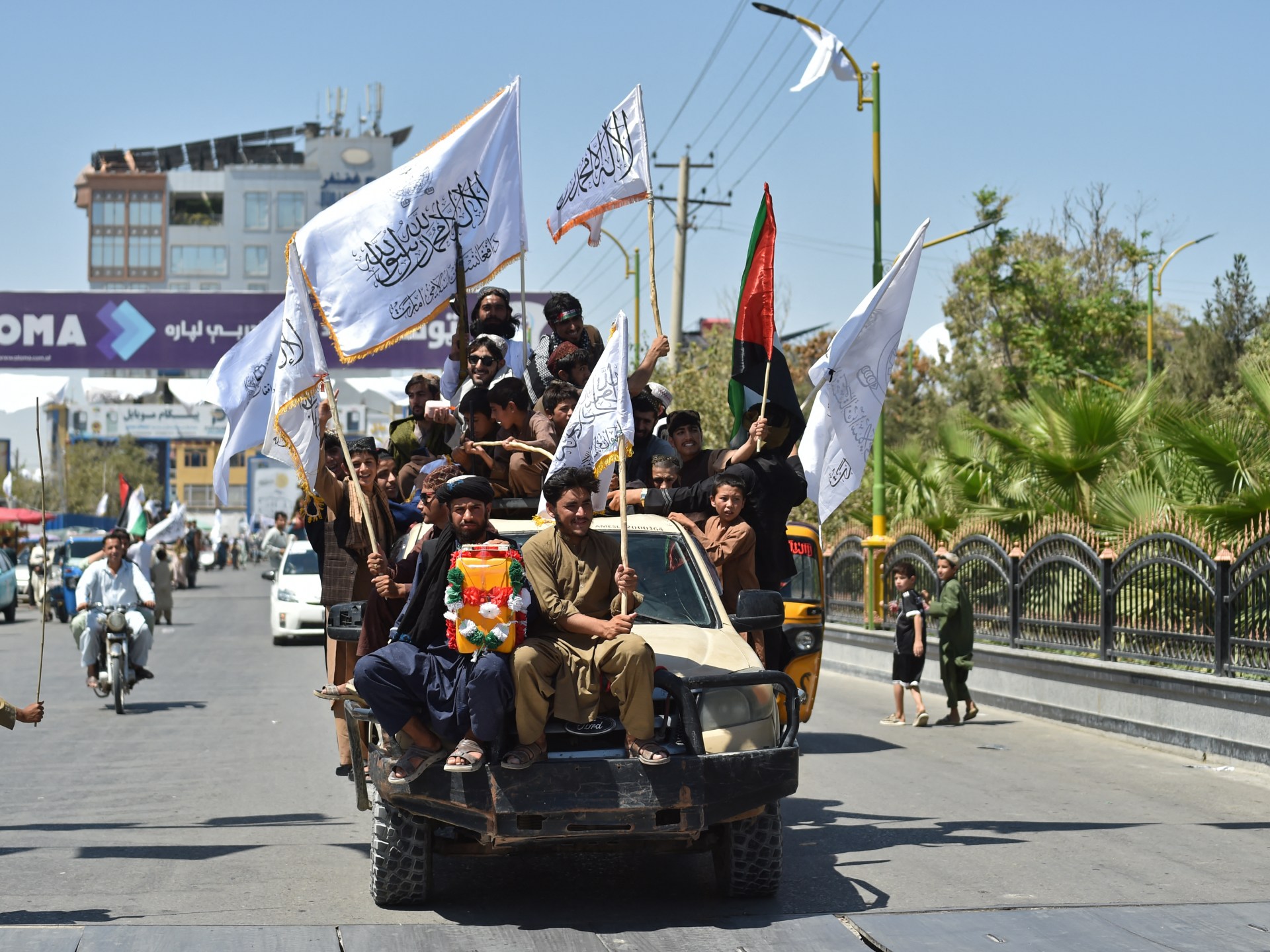 Photos: Patriotic music and flags mark Taliban rule anniversary in Kabul
